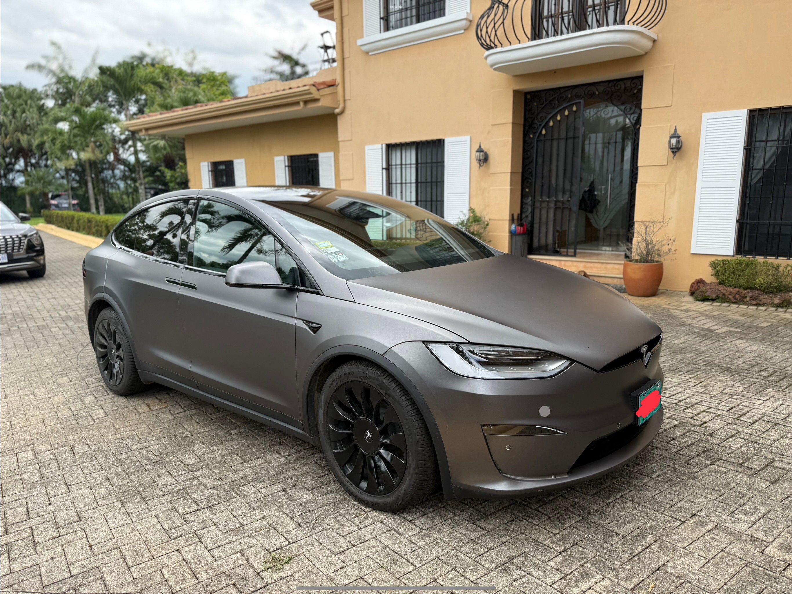 Tesla Model X Plaid driver‑side three‑quarter view