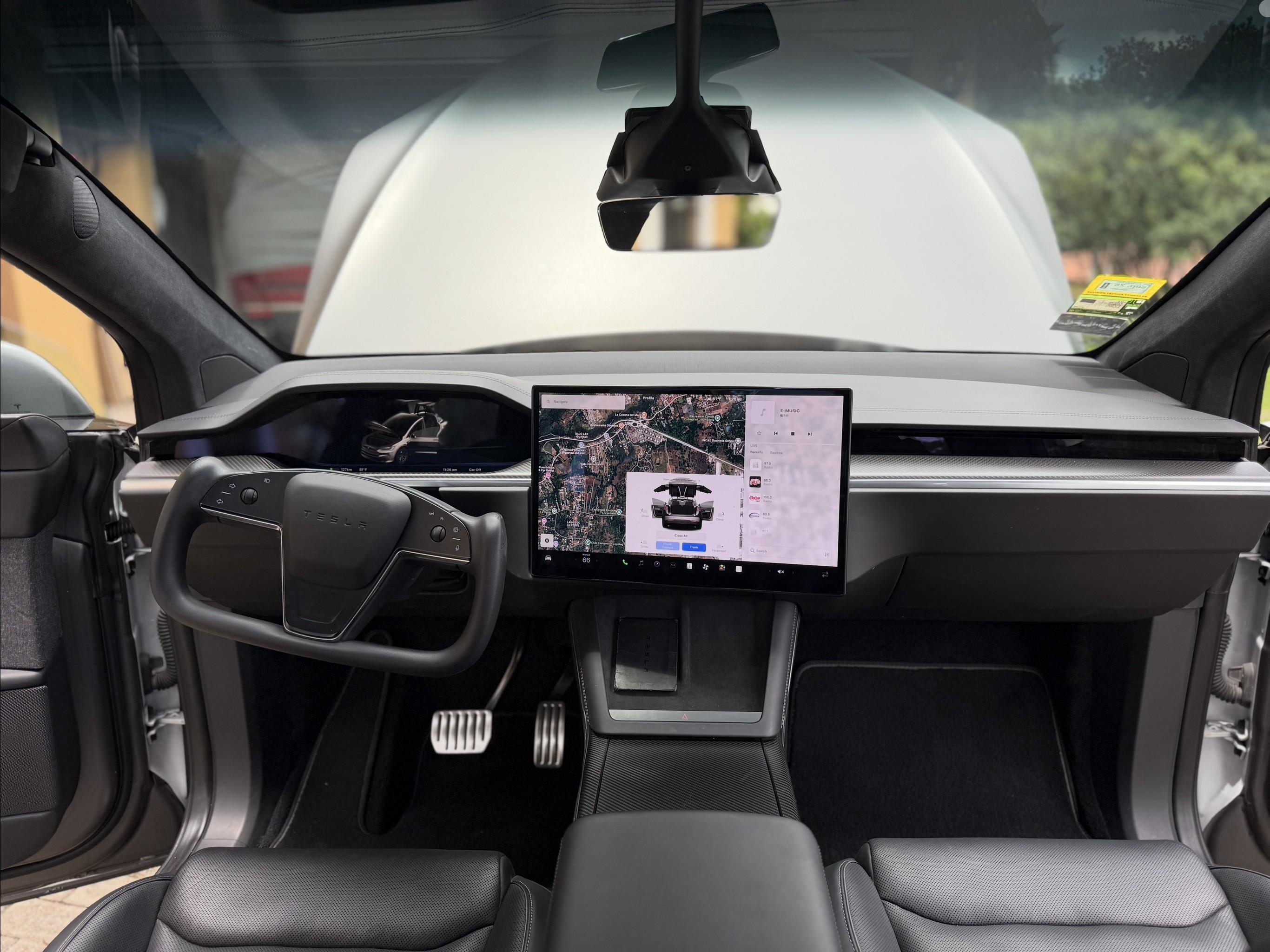 Tesla Model X Plaid yoke steering wheel and dashboard